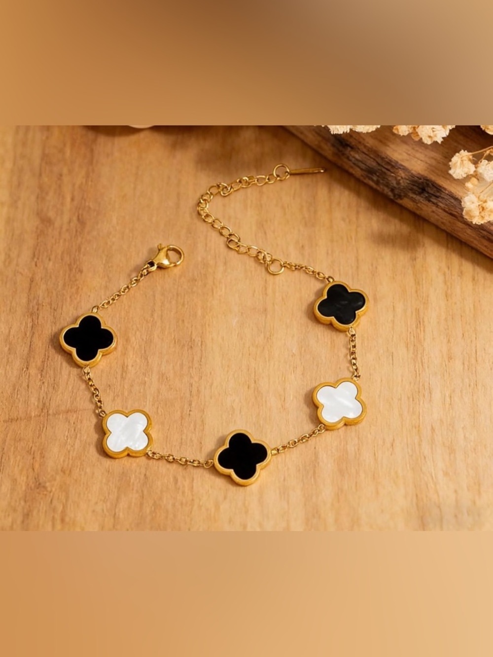 Gold Tone Black and White Clover Link Bracelet